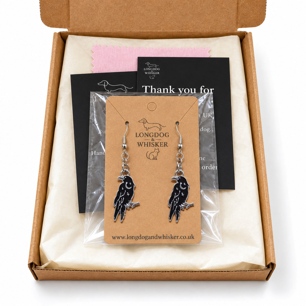 Black Raven Crescent Moon Drop Earrings in Longdog & Whisker packaging