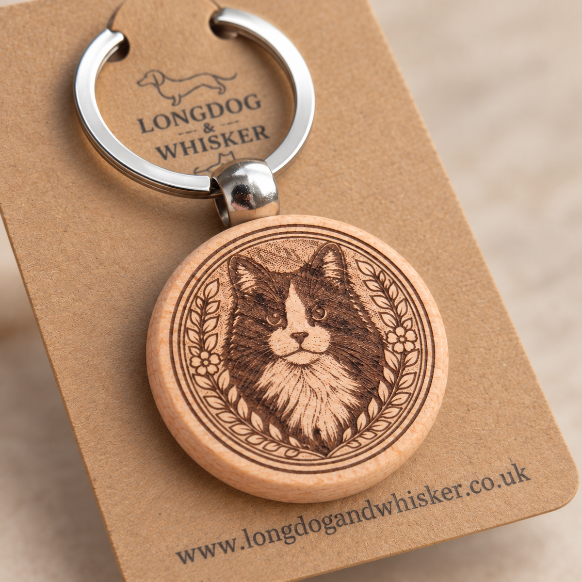 Close-up of the black and white long-haired cat engraving, wooden edge and silver connector