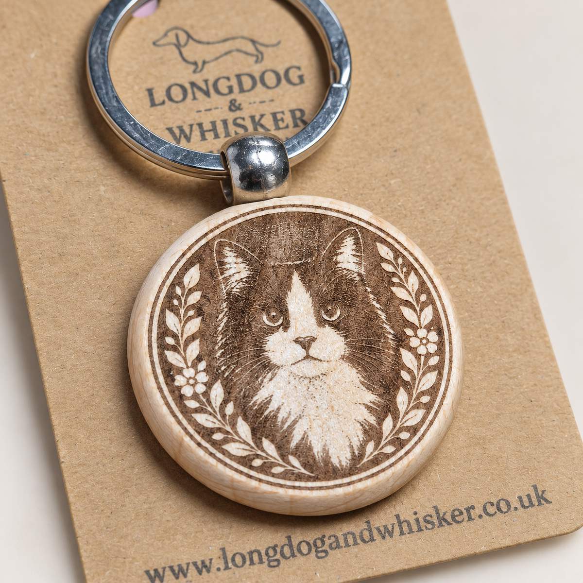 Close-up of the black and white long-haired cat wooden keyring engraving
