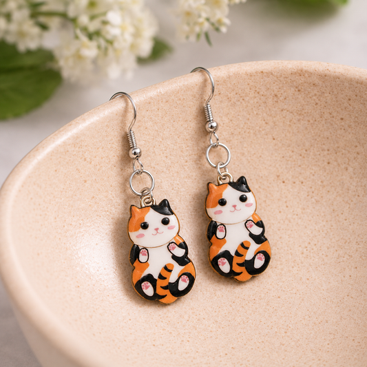 Belly Rub Cat Earrings - Calico displayed in a lifestyle product photo
