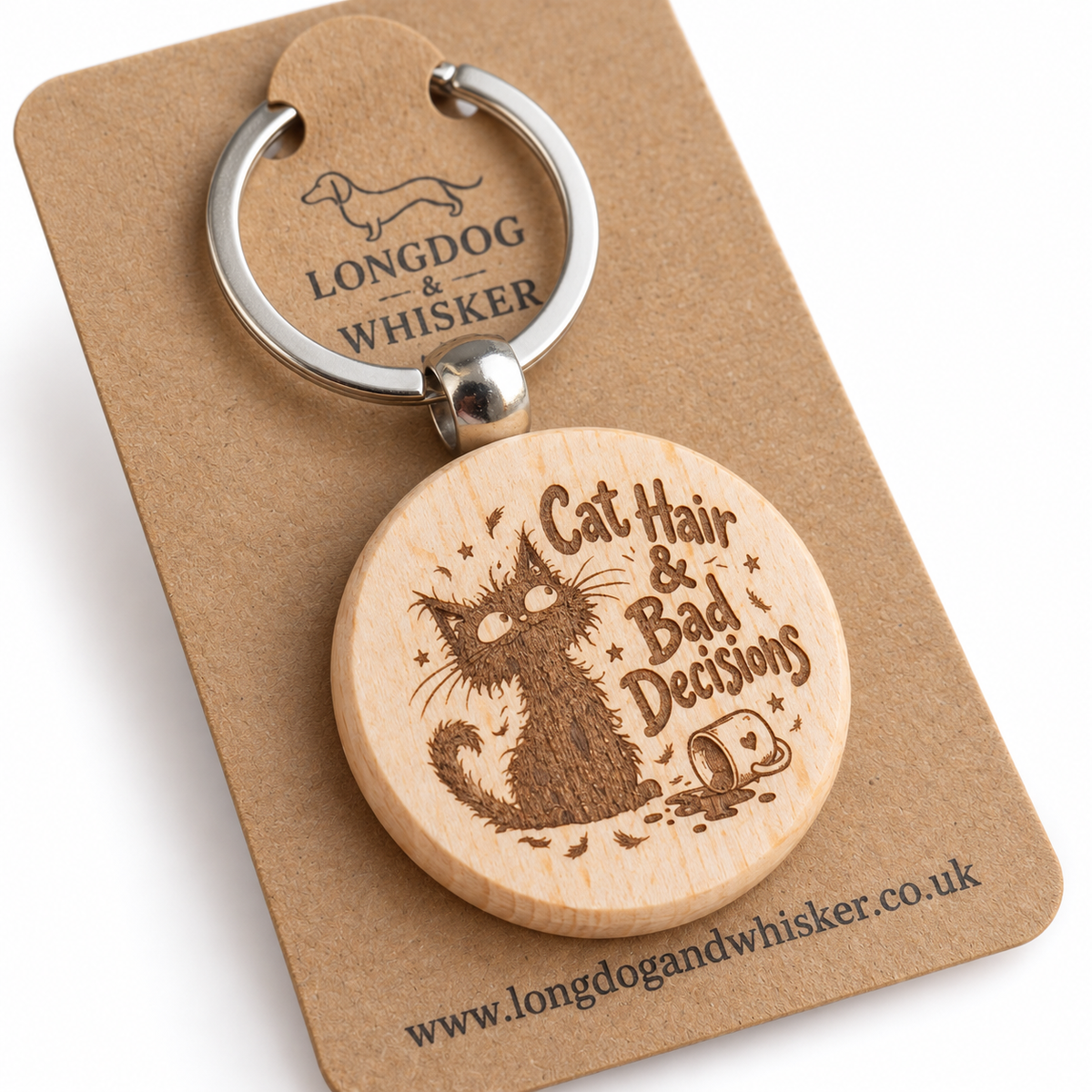 Close-up of Cat Hair and Bad Decisions engraving and rounded wooden keyring edge