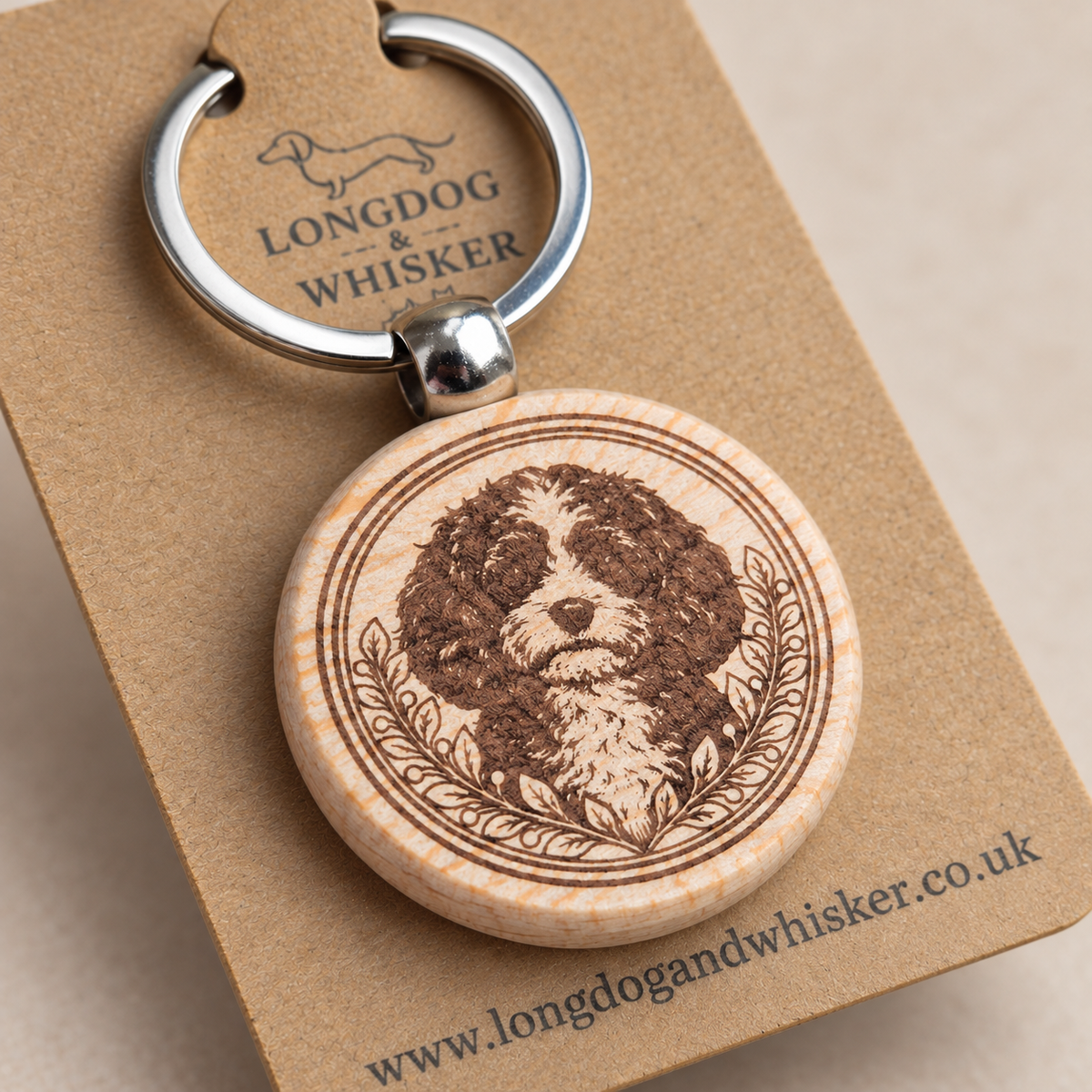 Close-up of Cavapoo portrait, leafy border, natural wood edge and silver connector