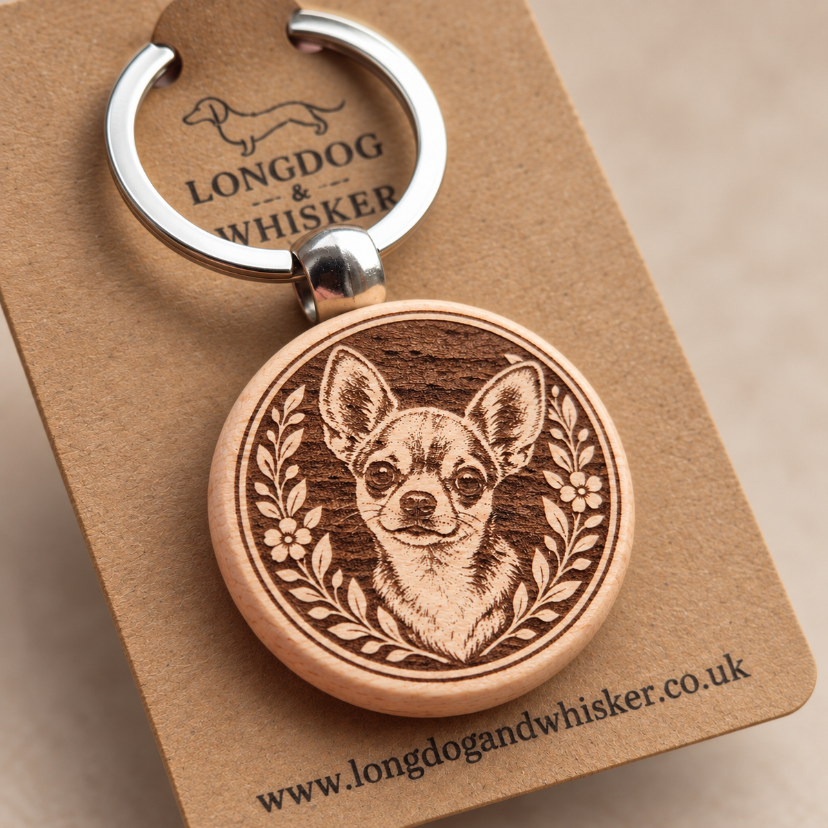 Close-up of the printed Chihuahua wooden keyring and silver-tone hardware