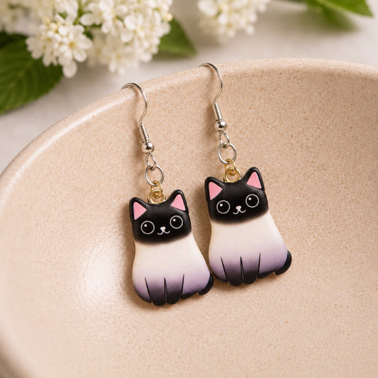 Chonky Cat Earrings - Siamese displayed in a lifestyle product photo