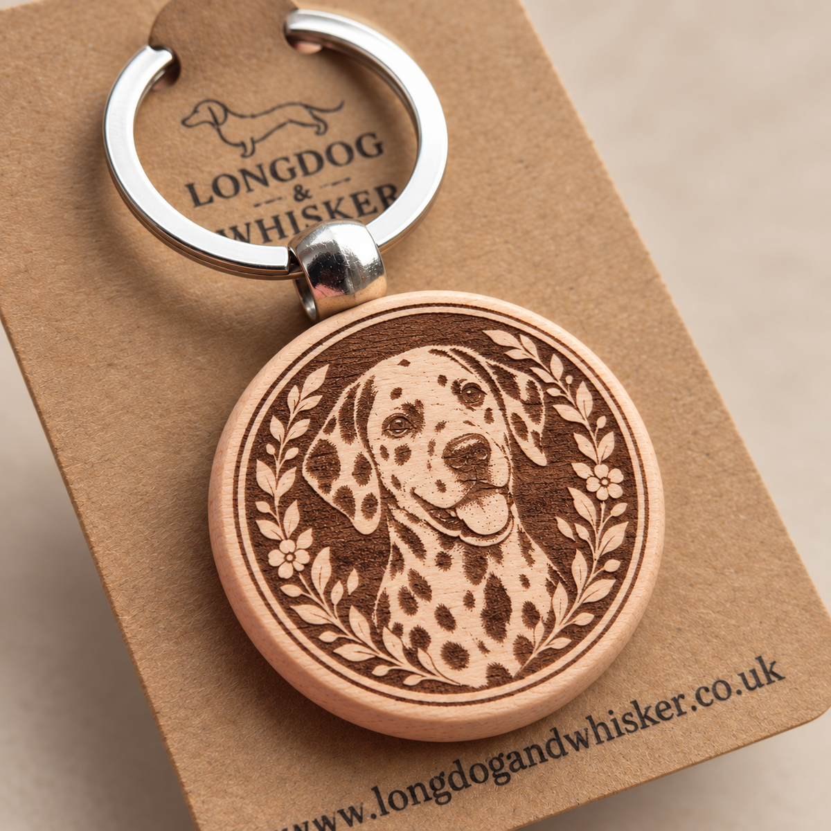 Close-up of the printed Dalmatian wooden keyring and silver-tone hardware