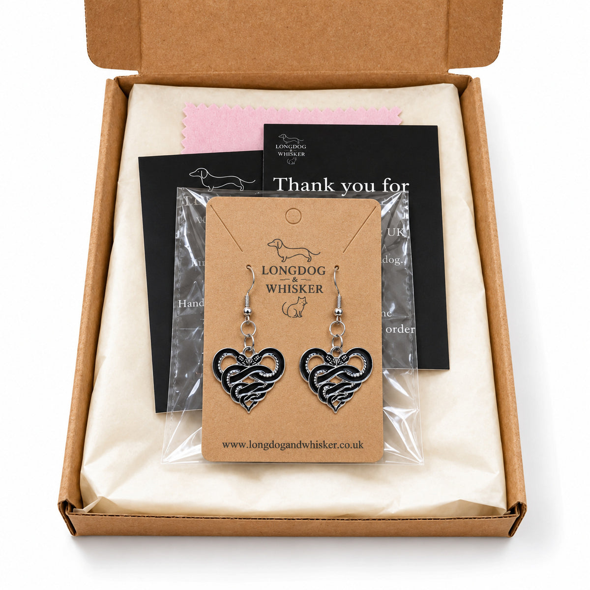 Entwined Snake Heart Drop Earrings presented in Longdog & Whisker packaging