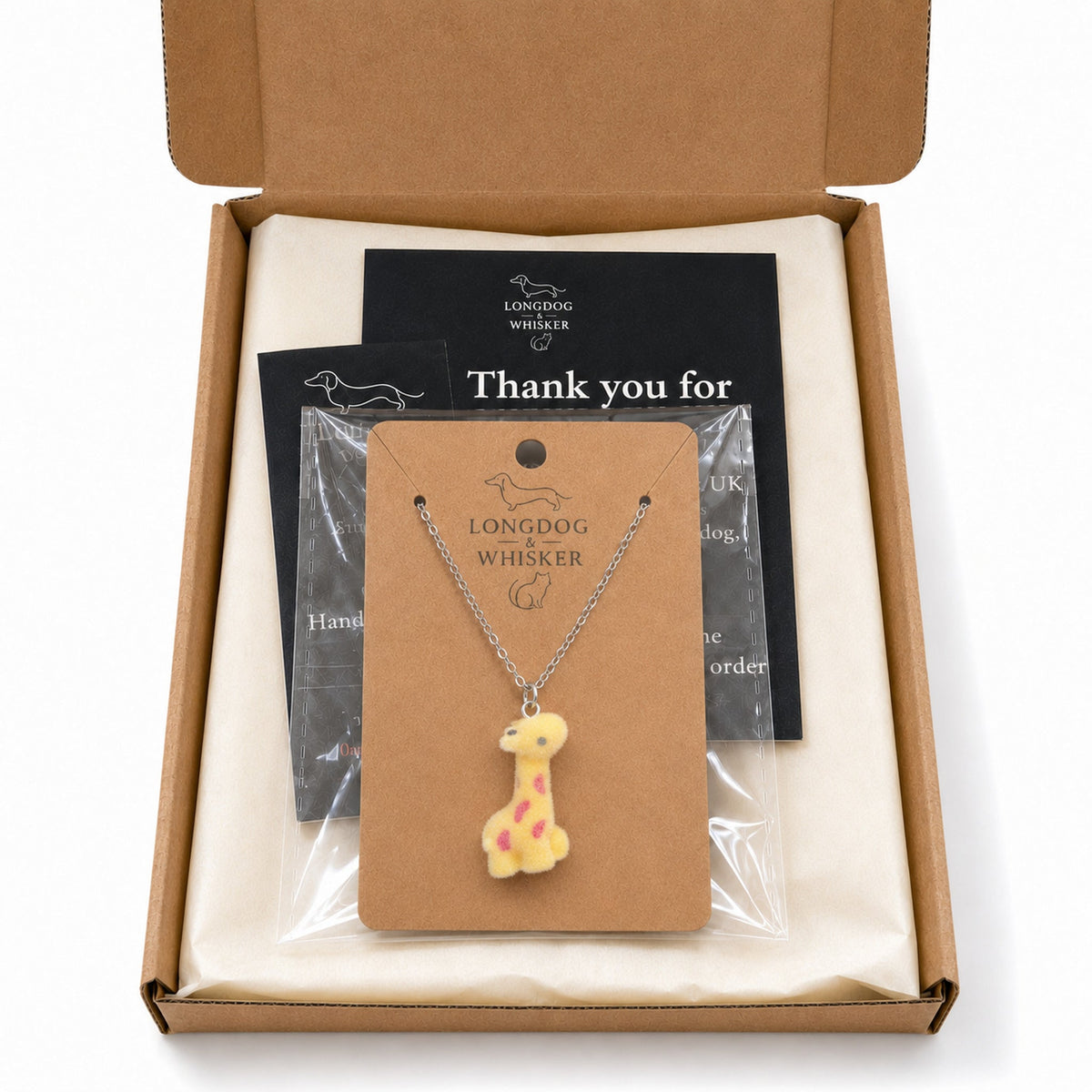 Fuzzy Giraffe Necklace in Longdog & Whisker gift-ready packaging