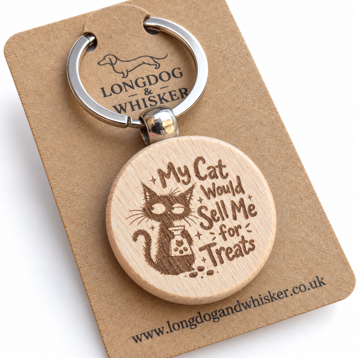 Close-up of My Cat Would Sell Me for Treats engraving and rounded wooden keyring edge