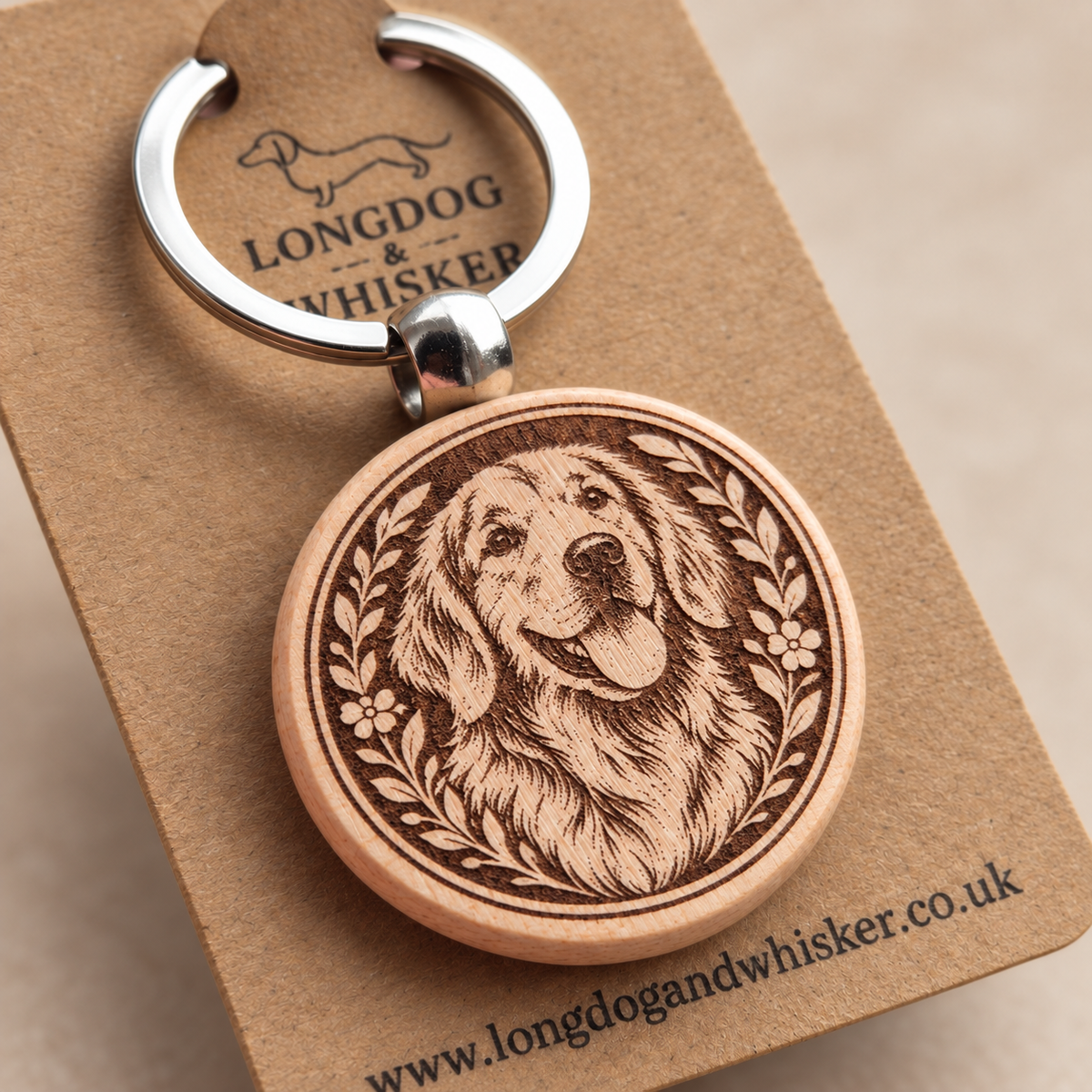 Close-up of the engraved Retriever wooden keyring and silver-tone hardware