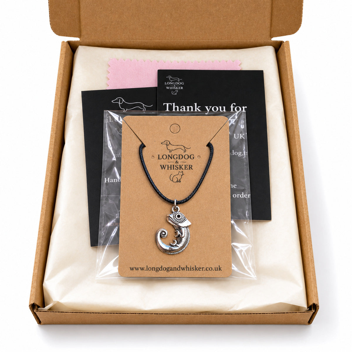 Silver-tone chameleon black cord necklace in Longdog & Whisker kraft packaging