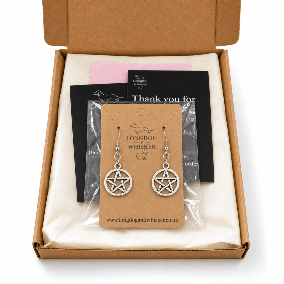 Silver pentagram earrings presented in Longdog & Whisker packaging