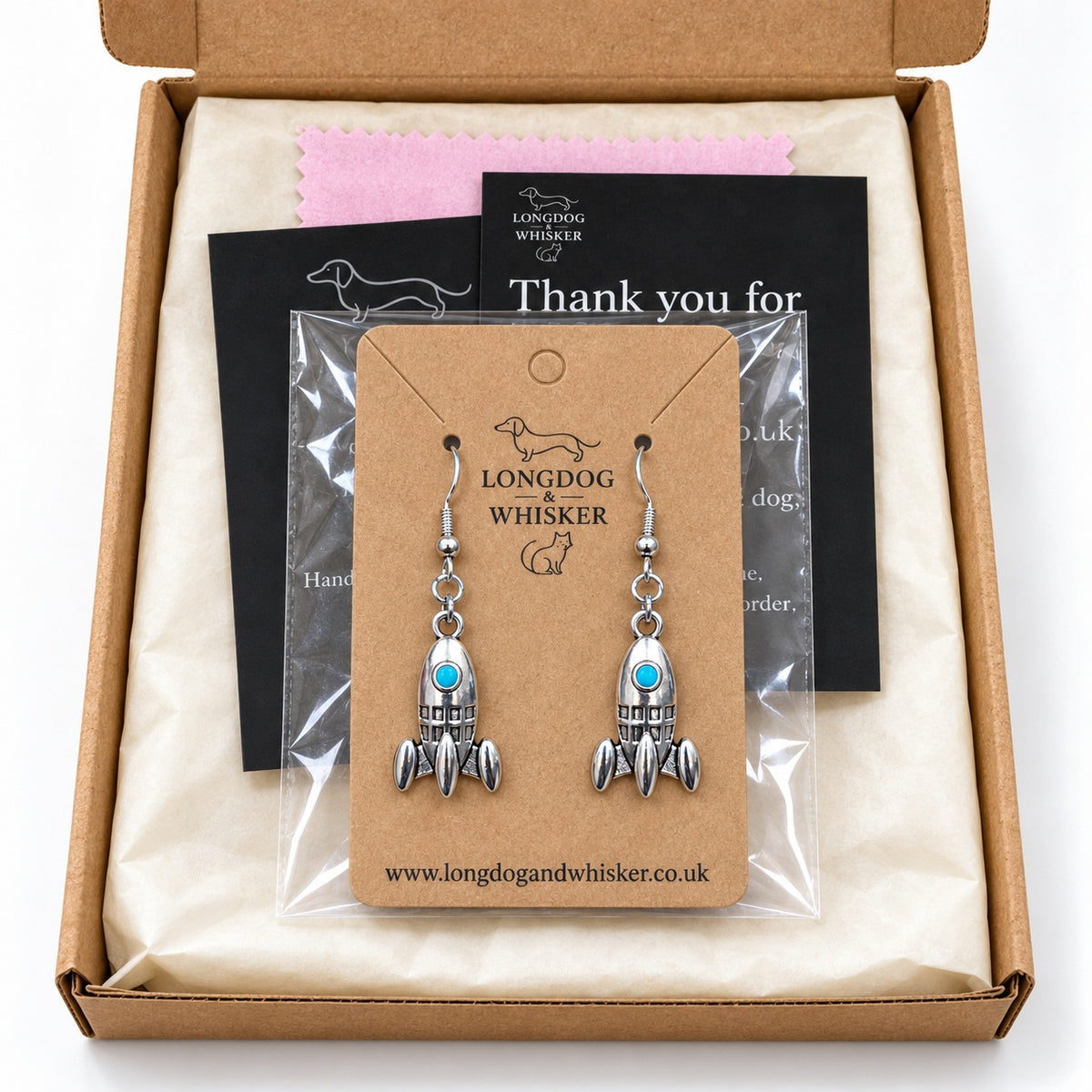 Silver rocket earrings on their product card in gift-ready Longdog & Whisker packaging