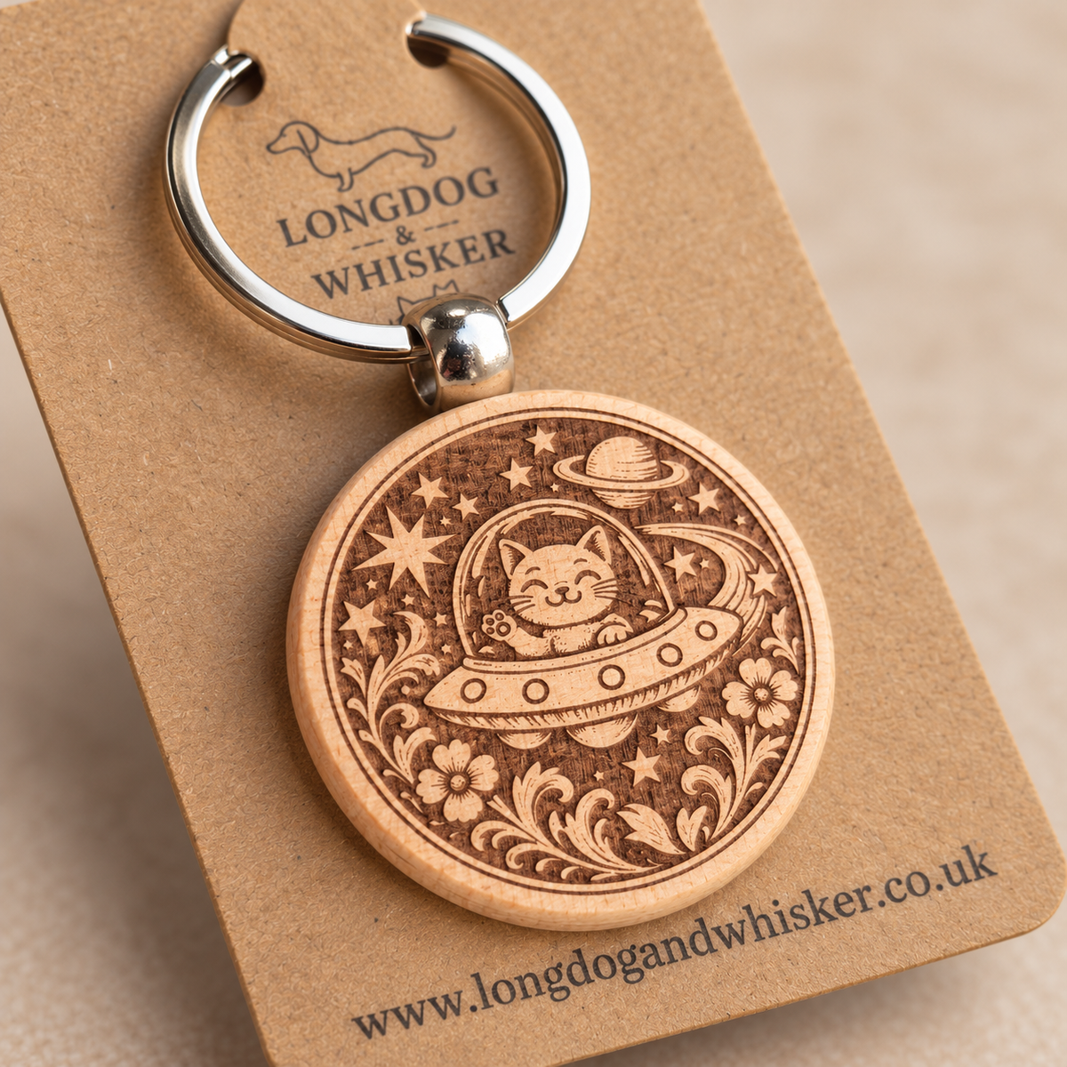 Close-up of the Space Cat UFO engraving, natural wooden edge and silver connector