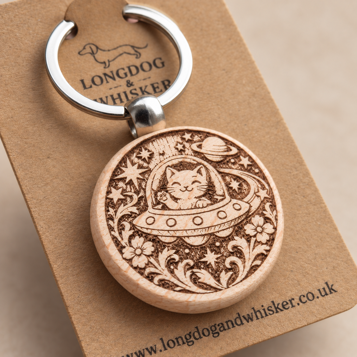Close-up of the Space Cat UFO wooden keyring engraving