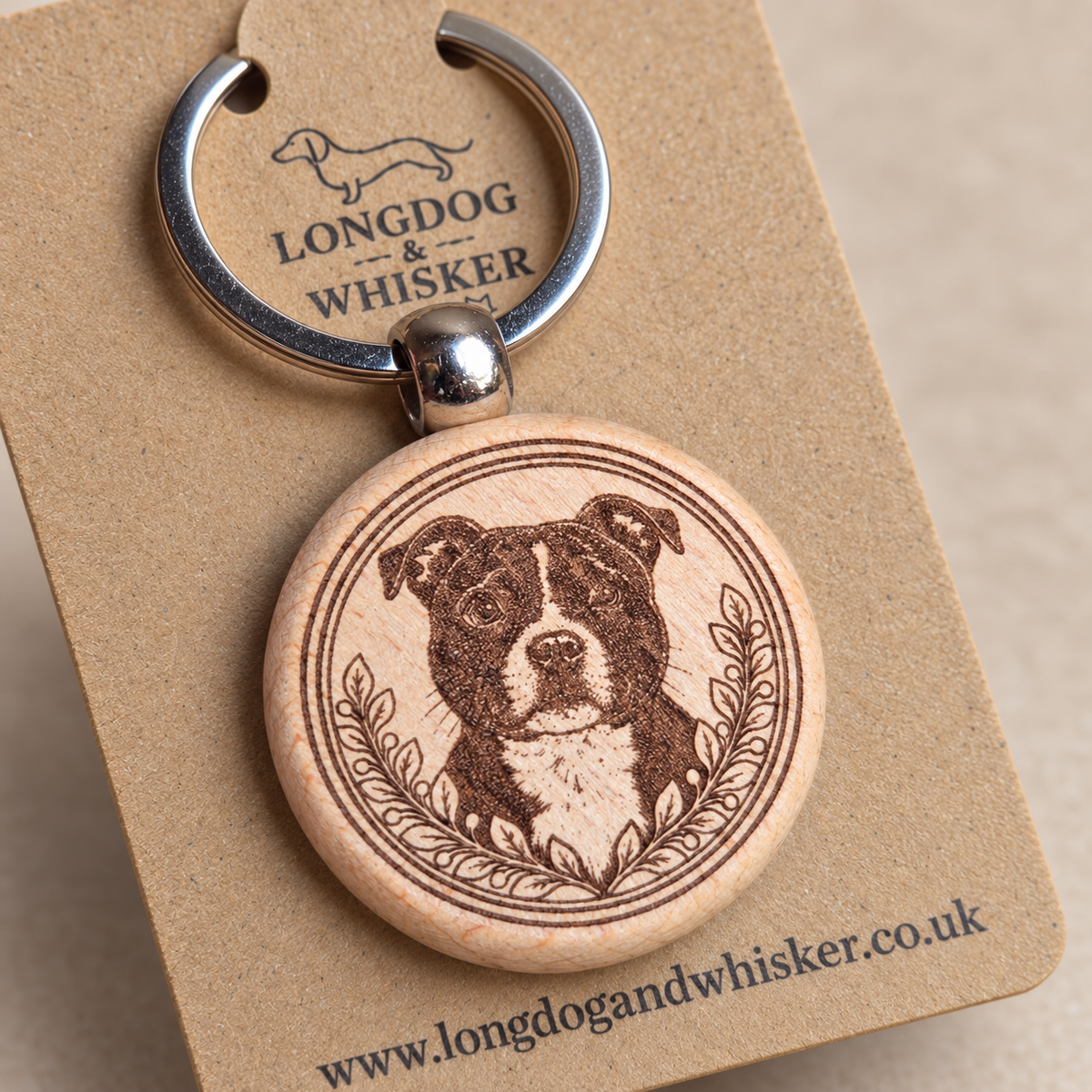 Close-up of Staffy portrait, leafy frame, natural wood edge and silver-tone connector