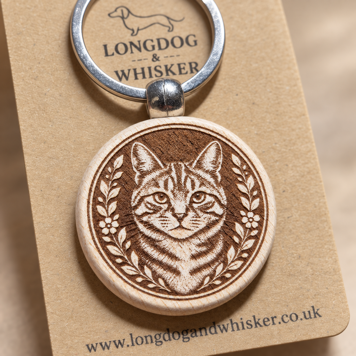 Close-up of the tabby cat engraving on a wooden keyring