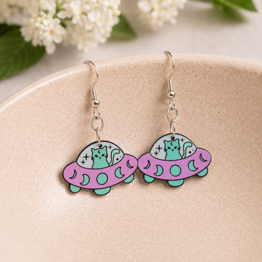 UFO Space Kitty Earrings displayed in a lifestyle product photo