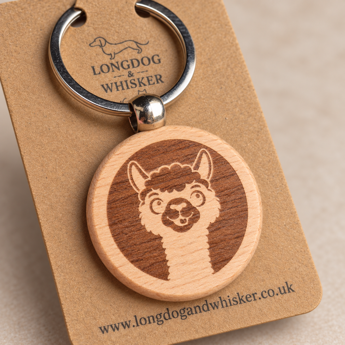 Close-up of the alpaca portrait engraving, natural wooden edge and silver connector