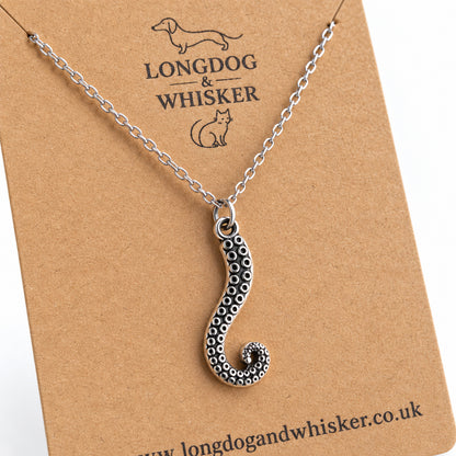 Close-up of silver chain tentacle necklace and raised sucker detail