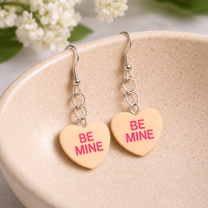 Be Mine Heart Earrings - Orange displayed in a lifestyle product photo
