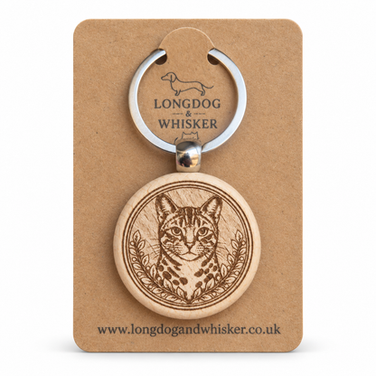 Bengal cat wooden keyring with spotted portrait and leafy frame on Longdog & Whisker card