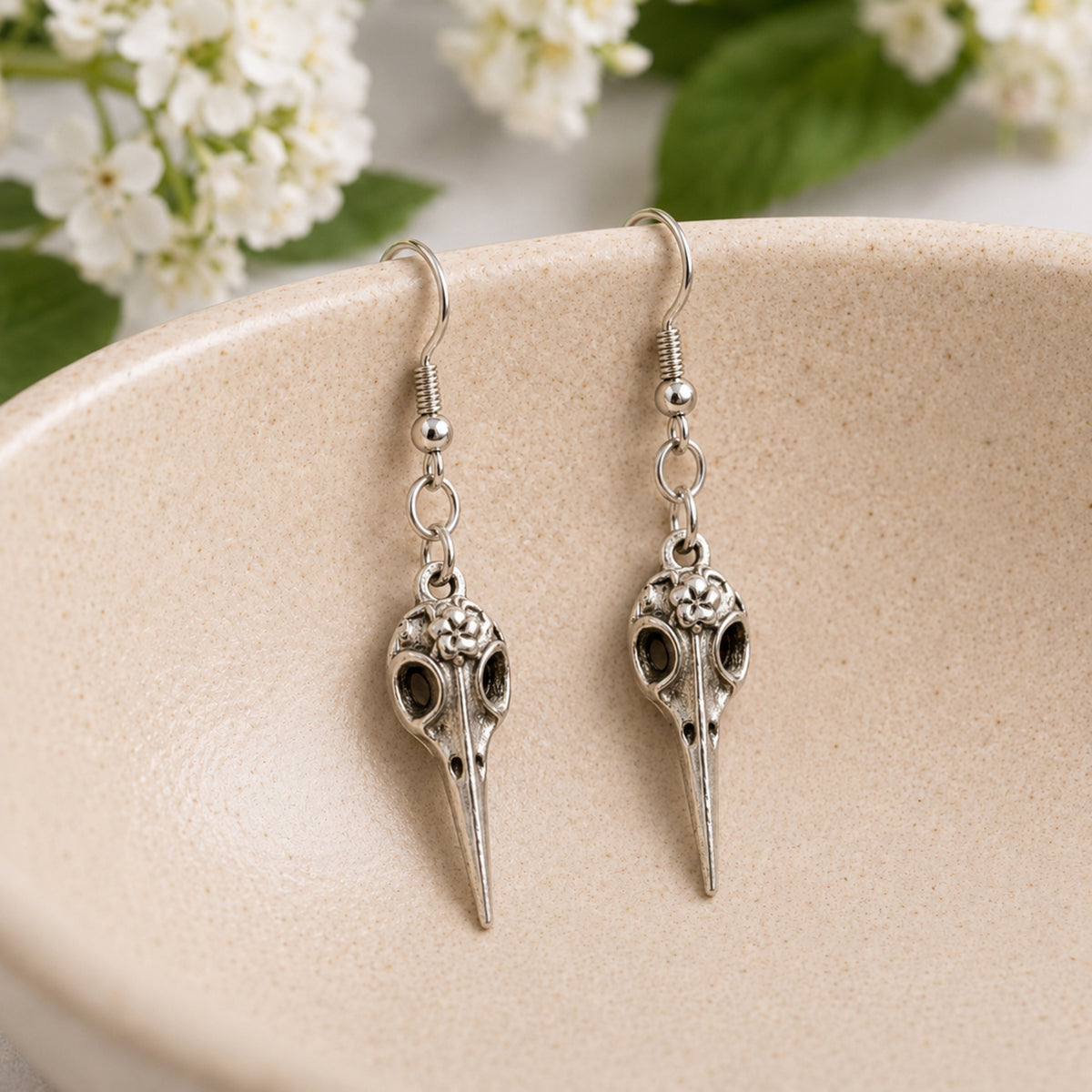 Bird Skull Earrings - Design 2 displayed in a lifestyle product photo