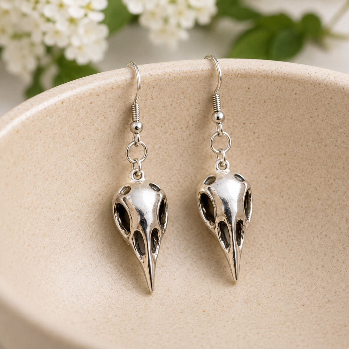 Bird Skull Earrings - Design 4 displayed in a lifestyle product photo