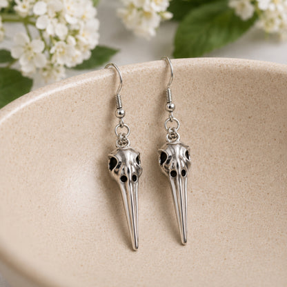 Classic Bird Skull Earrings displayed in a lifestyle product photo