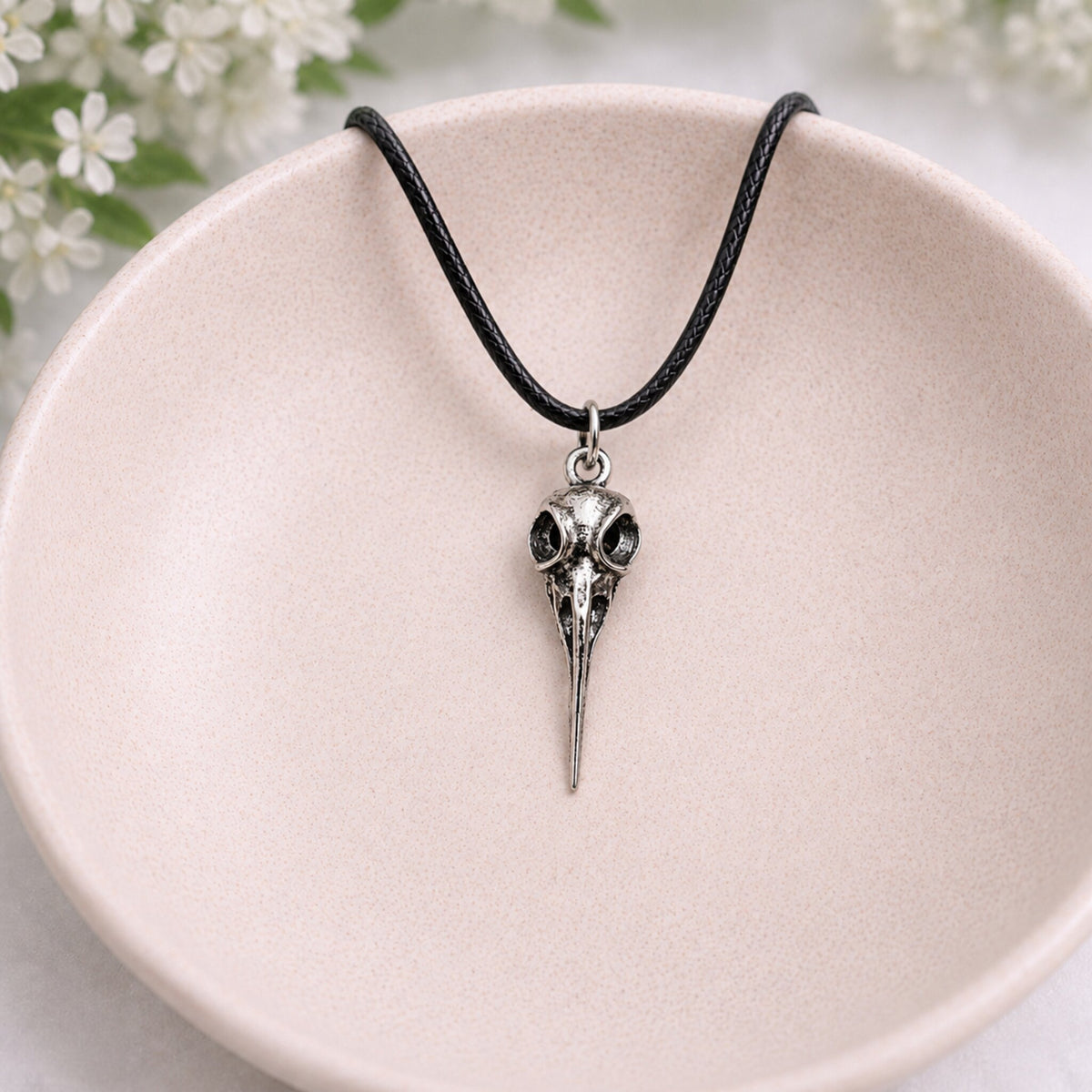 Bird Skull Design 3 Necklace displayed in a lifestyle product photo