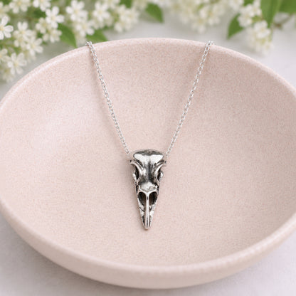 Bold Bird Skull Necklace displayed in a lifestyle product photo