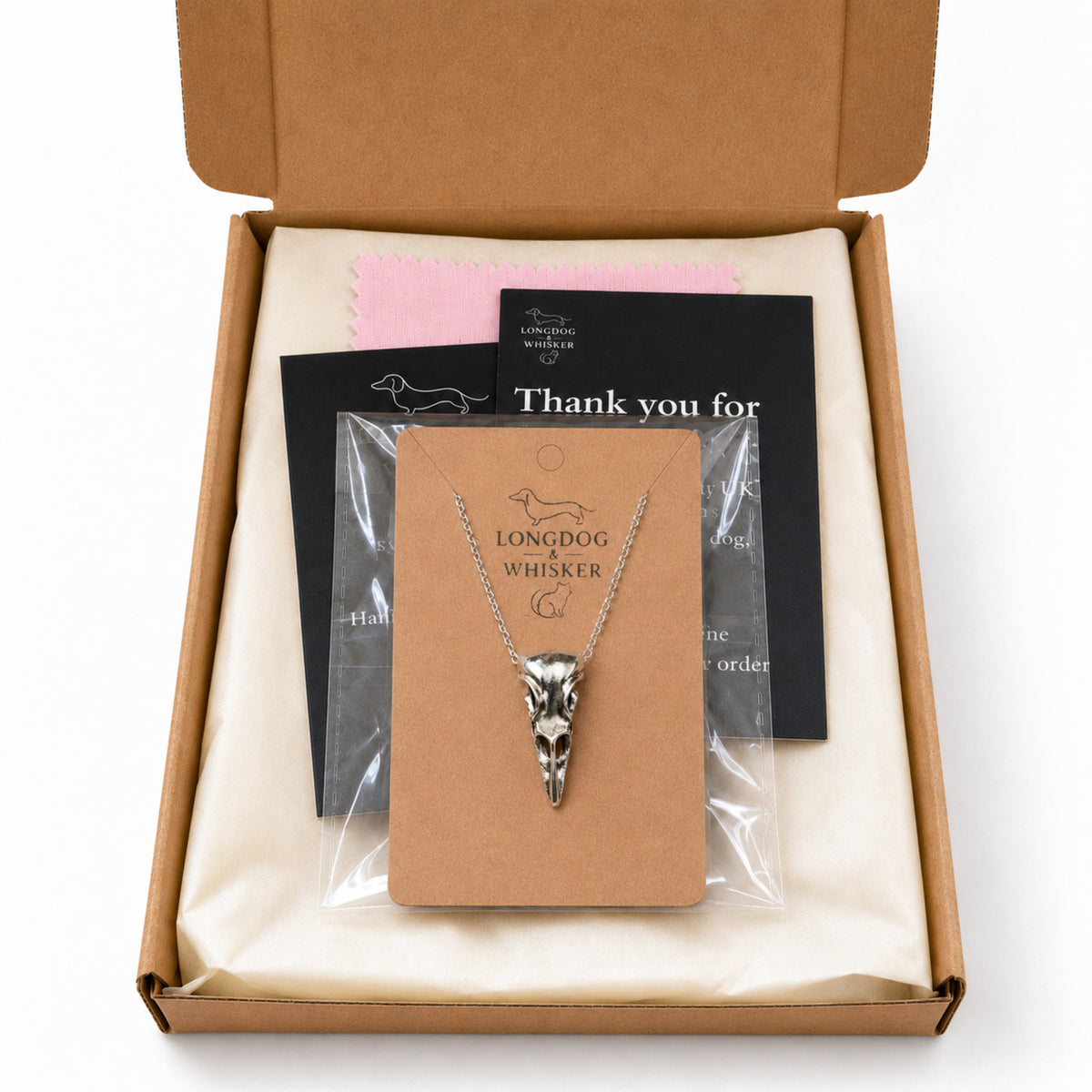 Bold Bird Skull Necklace with Longdog & Whisker packaging