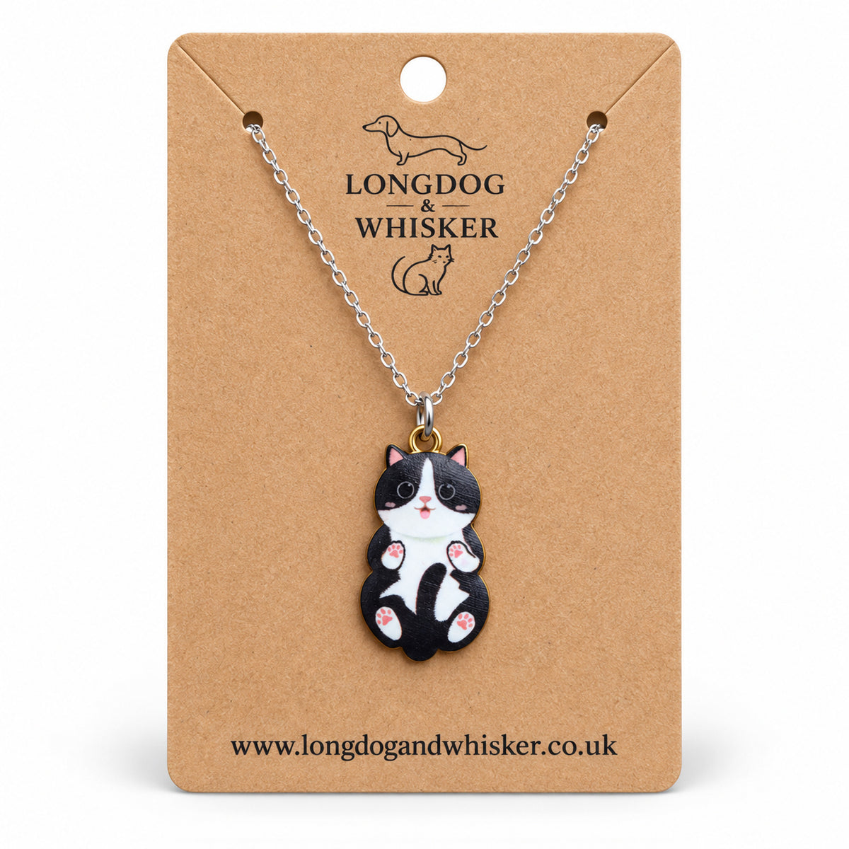 Black and White Belly Rub Cat Necklace on a silver-tone chain displayed on a Longdog & Whisker kraft card