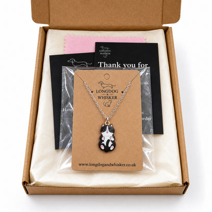 Black and White Belly Rub Cat Necklace in gift-ready Longdog & Whisker packaging