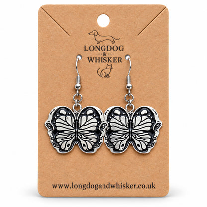 Black butterfly drop earrings on Longdog & Whisker card
