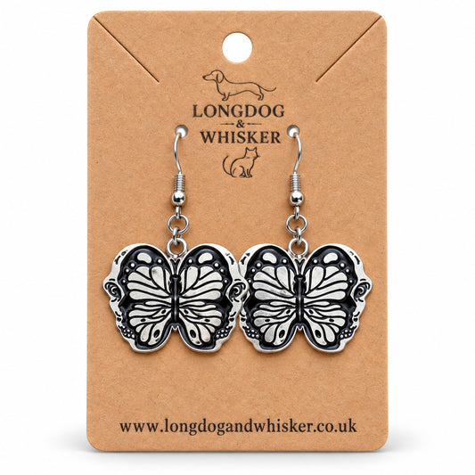 Black butterfly drop earrings on Longdog & Whisker card