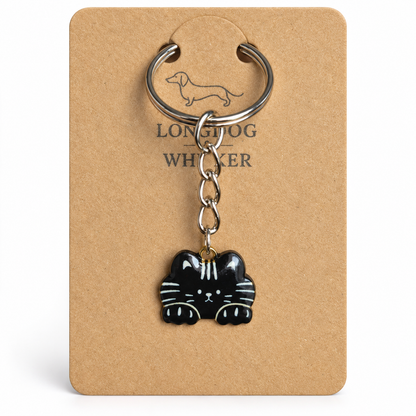 Close-up of black cat keyring and silver-tone chain