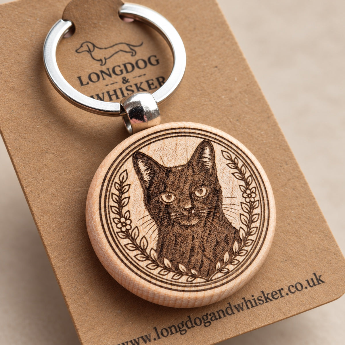 Close-up of the black cat portrait, floral border and natural wooden edge