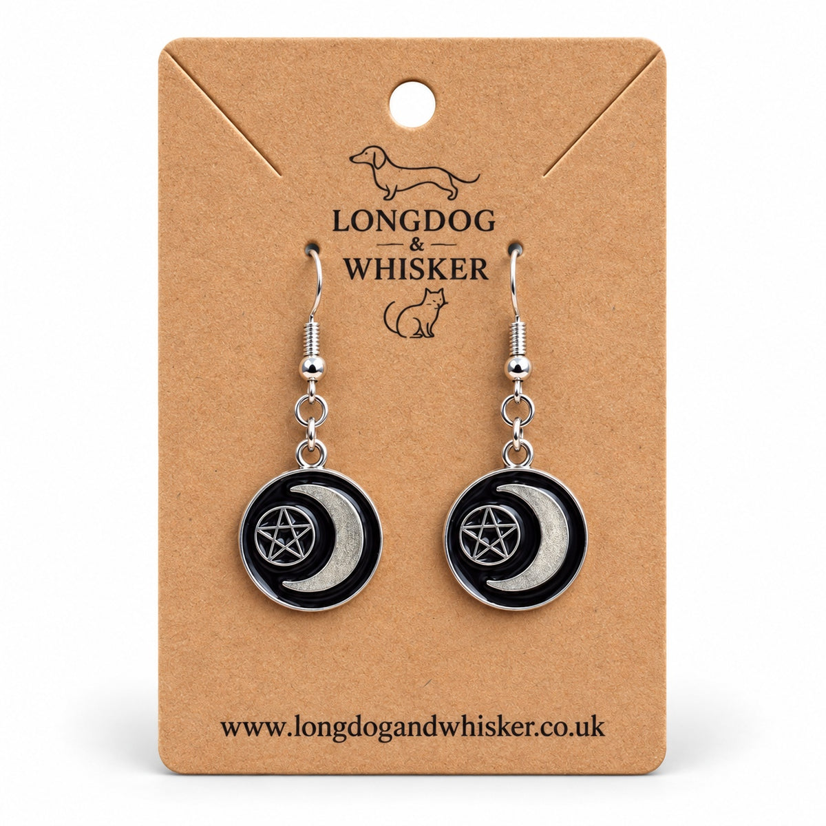 Black crescent moon and pentagram drop earrings on a Longdog & Whisker kraft product card