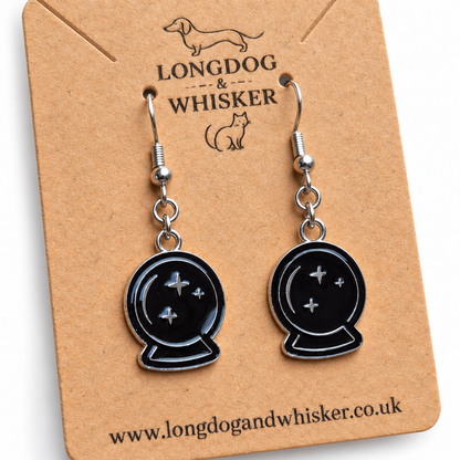 Close detail of black crystal ball drop earrings on a Longdog & Whisker card