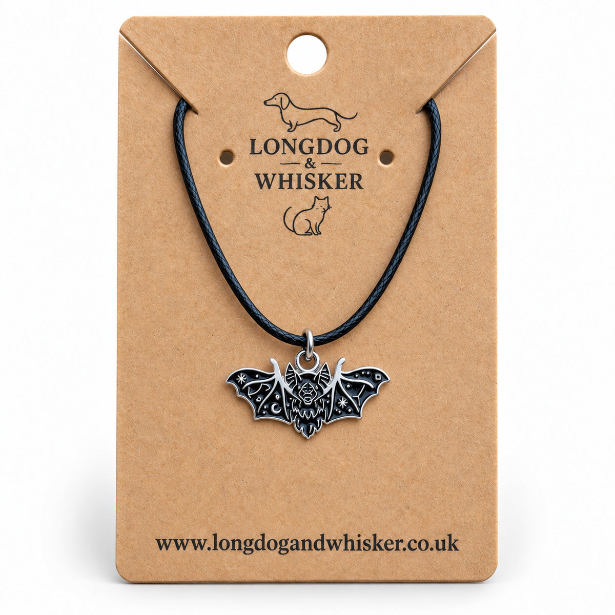 Black fanged bat necklace on a black cord, displayed on a Longdog & Whisker kraft card