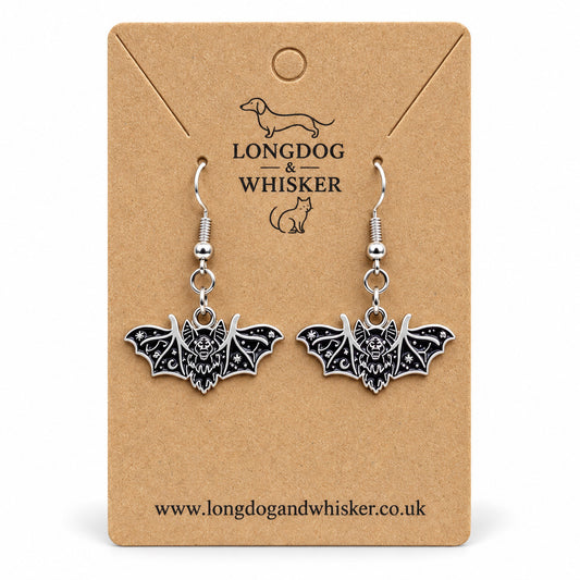 Black and silver fanged bat drop earrings on Longdog & Whisker kraft card