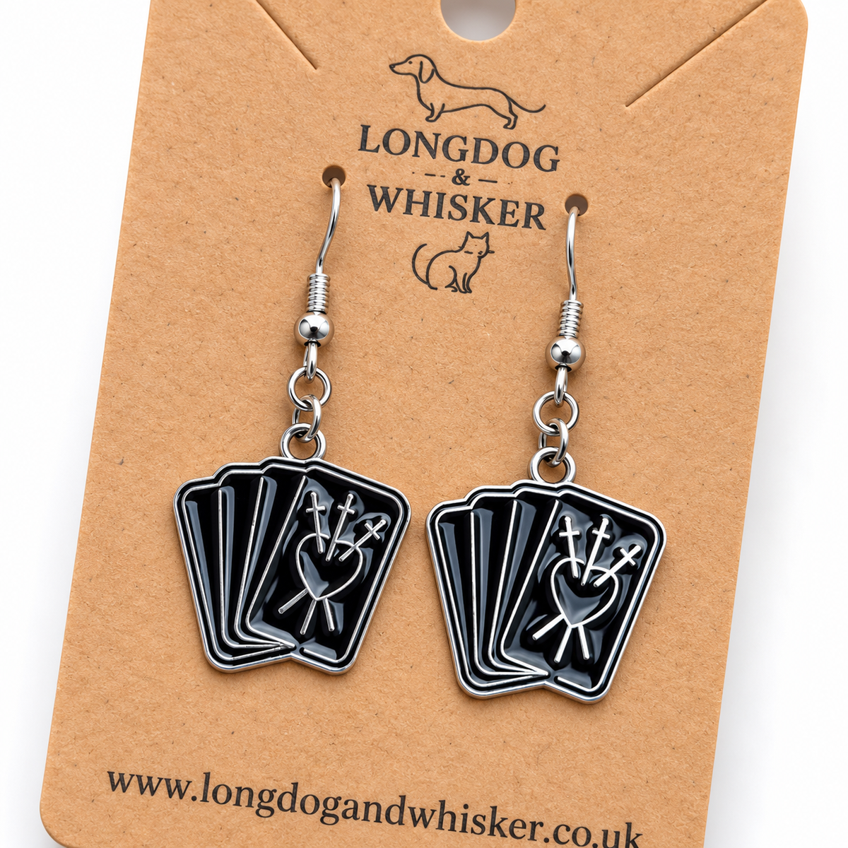 Close detail of black fortune teller card drop earrings on a Longdog & Whisker card