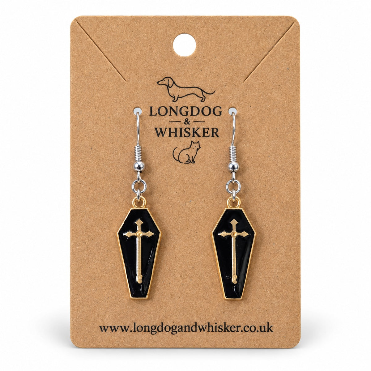 Black coffin cross earrings with gold-tone borders and silver-tone hooks on a Longdog & Whisker kraft card