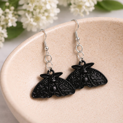 Black Moth Earrings displayed in a lifestyle product photo