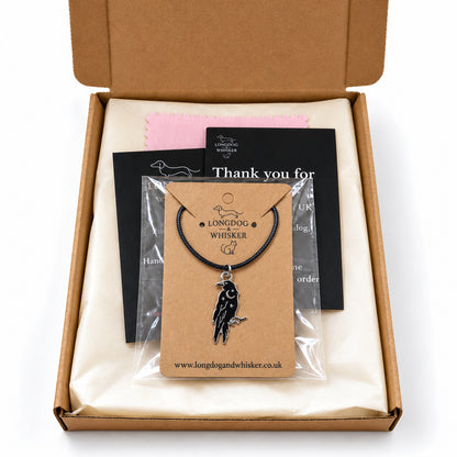Black raven black-cord necklace in Longdog & Whisker postal packaging