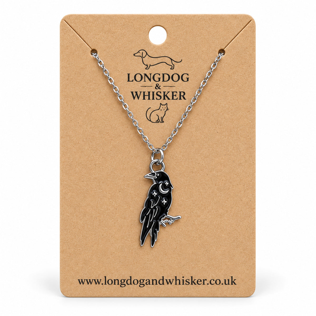 Black raven crescent moon necklace on a silver chain, displayed on a Longdog & Whisker kraft card