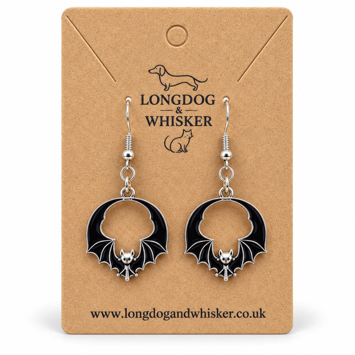 Black round wing bat drop earrings with silver-tone details on a Longdog & Whisker kraft card