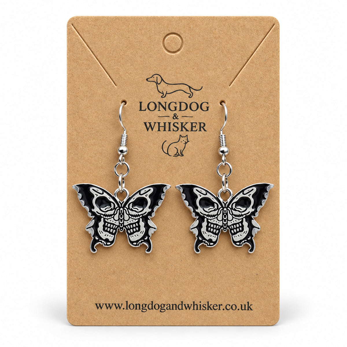Black and silver double skull butterfly earrings on Longdog & Whisker kraft card