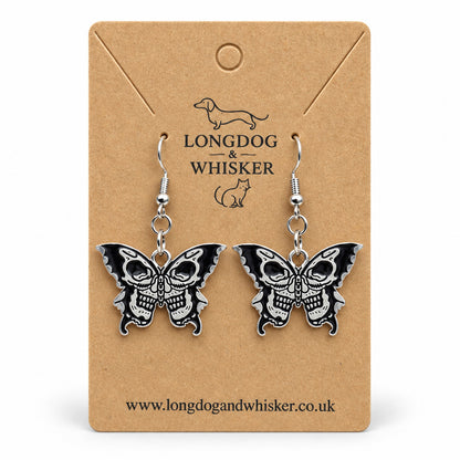 Black and silver double skull butterfly earrings on Longdog & Whisker kraft card