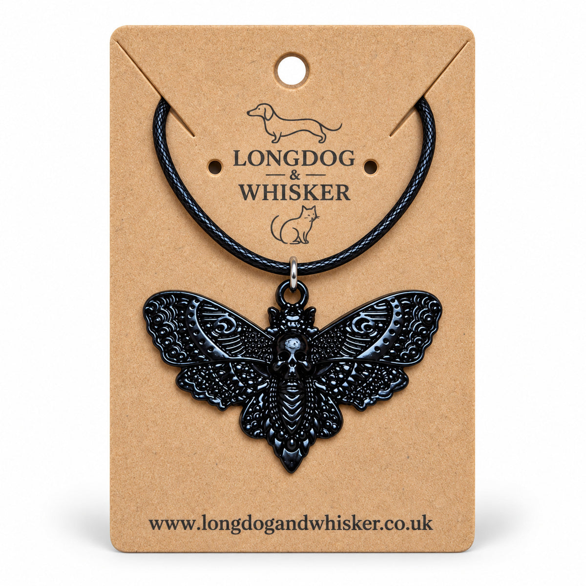 Black skull moth necklace on black cord, displayed on a Longdog & Whisker kraft card